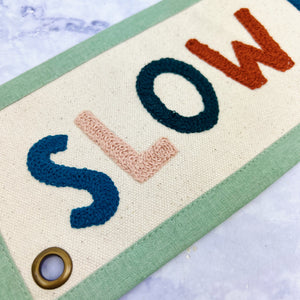 Slow Down Embroidered Banner