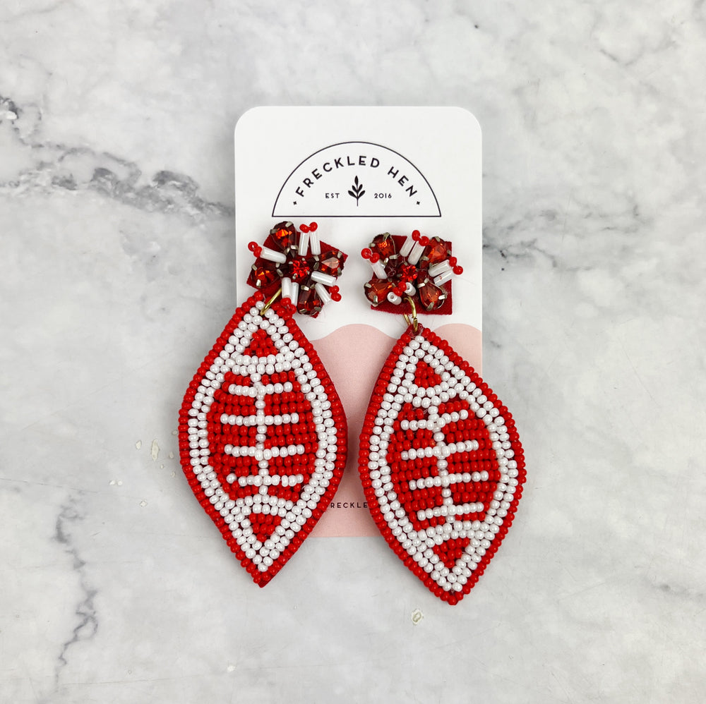 
                
                    Load image into Gallery viewer, Red and White Beaded Football Earrings
                
            